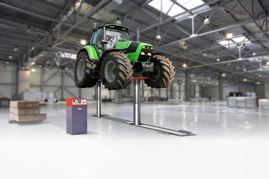 In-ground Stertil-Koni piston vehicle lift Diamondlift with tractor 